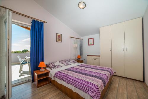 Katil atau katil-katil dalam bilik di Apartments Đurđa