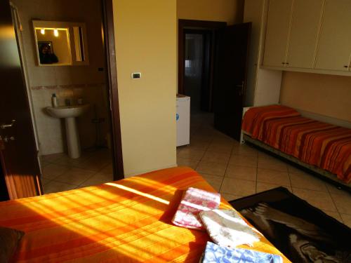 a room with a bed and a sink and a bathroom at San Marco in Pisa