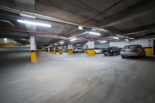 a parking garage with cars parked in it at Medproper Suites Airport in Istanbul