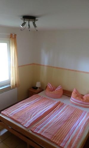 a bedroom with a large bed in a room at Unter den Linden 7 in Ralswiek
