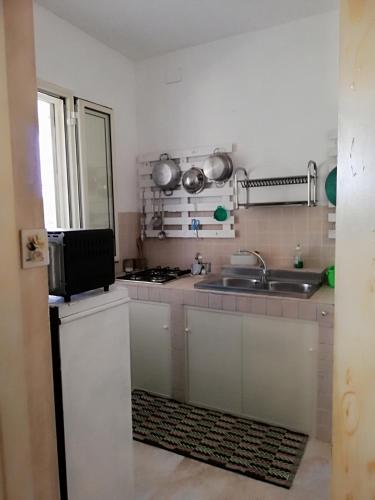 Η κουζίνα ή μικρή κουζίνα στο Finestre Sul Mare Salento - CasaVacanza