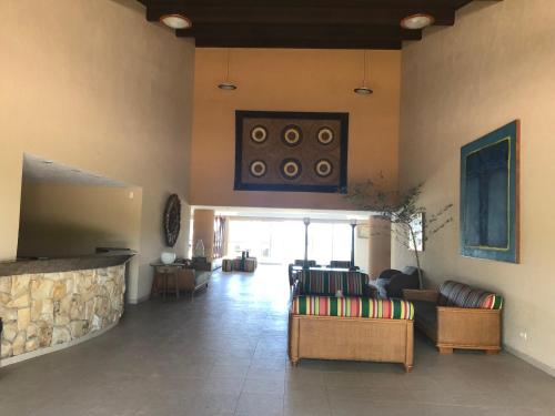 Et tv og/eller underholdning på MARUPIARA SUITES- FLAT MURO ALTO