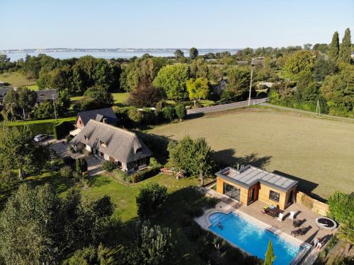 an aerial view of a house with a swimming pool at La Griotte & Spa&Piscine in Pennedepie