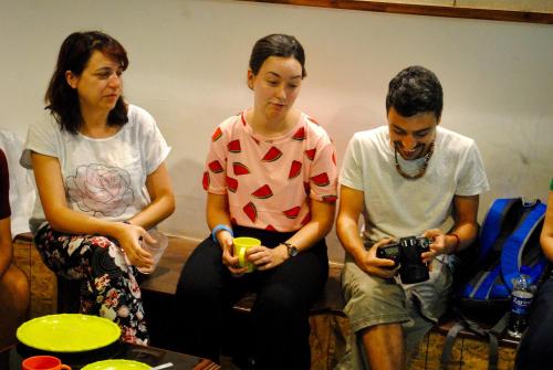 a group of three people sitting on a couch at Hostel Mantra in Mumbai