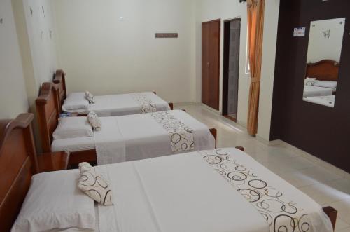 Postel nebo postele na pokoji v ubytování Hotel Plaza Cúcuta Center