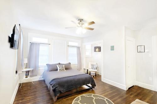 a bedroom with a bed and a ceiling fan at Local Hotspot SHELTER IN PLACE HERE! in Dallas