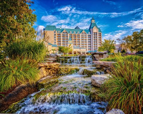 a waterfall in front of the disneyland resort at Chateau on the Lake Resort Spa and Convention Center in Branson
