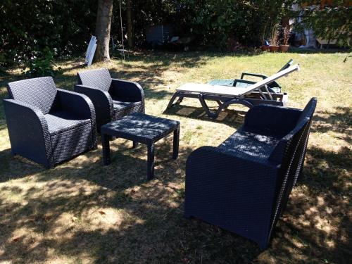 a group of chairs and a table in a yard at Le Ruchoz in Lausanne