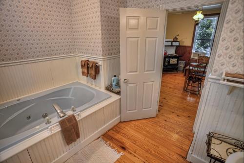 a bathroom with a large tub in a room at Silver Ridge Resort in Eureka Springs