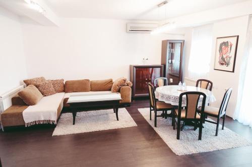 a living room with a couch and a table at Apartment Fila in Kochani