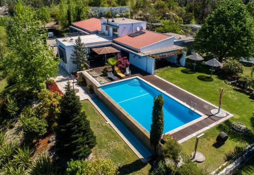 an aerial view of a house with a swimming pool at Casa da Costa Grande in Amarante