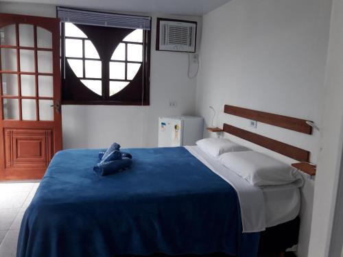 Un pat sau paturi într-o cameră la Mirante Bela Vista