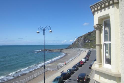 a street with cars parked on the beach at The Glengower in Aberystwyth