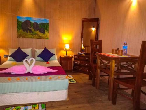 Ένα ή περισσότερα κρεβάτια σε δωμάτιο στο girilena resort
