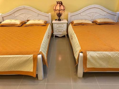 Ένα ή περισσότερα κρεβάτια σε δωμάτιο στο Thu Linh Homestay
