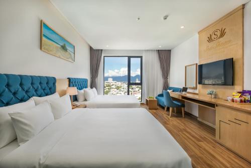 Postel nebo postele na pokoji v ubytování Seashore Hotel & Apartment