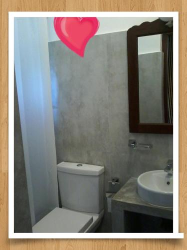 a bathroom with a toilet and a sink at Secret Palace Guest house in Galle
