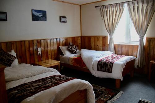 Postel nebo postele na pokoji v ubytování Panorama Lodge and Restaurant