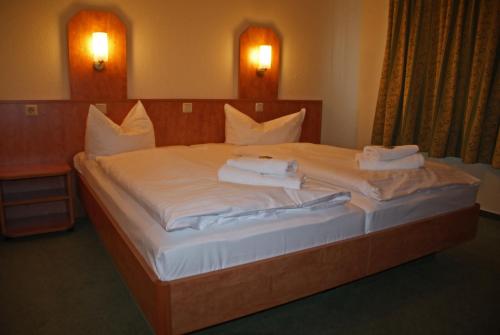 En eller flere senge i et værelse på Gasthof zur Mühle