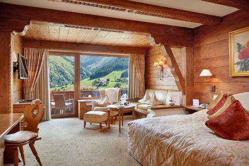 Postel nebo postele na pokoji v ubytování Hotel Singer – Relais & Châteaux