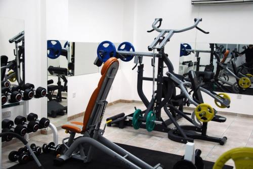 a gym with several exercise bikes in a room at Sky Hotel in Nicosia