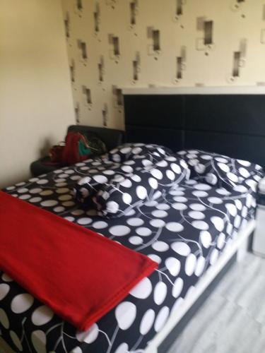 Cama o camas de una habitación en Suites Metro Bandung - Aloha