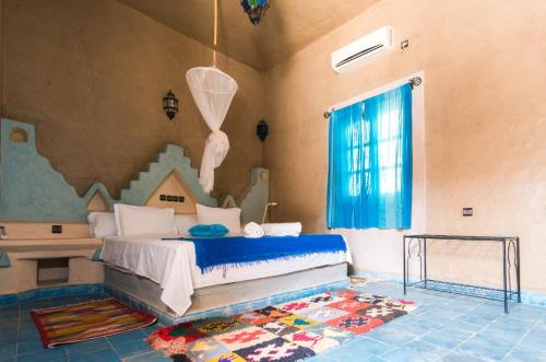 En eller flere senger på et rom på Riad Ouzine Merzouga