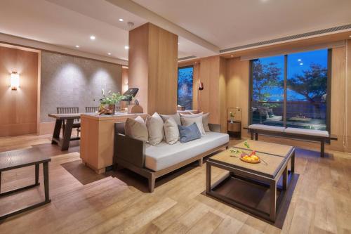 a living room with a couch and a table at Apexvilla-moon in Dongshan