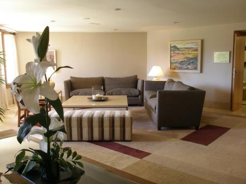 a living room with a couch and a table at Parador de Puebla de Sanabria in Puebla de Sanabria