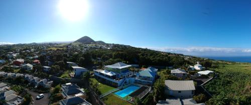 an aerial view of a house on a hill at Hôtel Le Soleil Couchant in Saint-Pierre