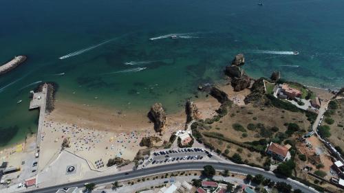 an aerial view of a beach with a crowd of people at Racing Mackerel Hostel in Lagos