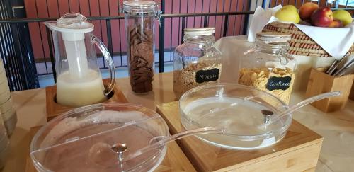 a table with a bowl of milk and other ingredients at Certosa 1515 in Avigliana