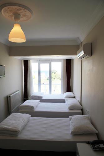 Katil atau katil-katil dalam bilik di Boss 2 Hotel