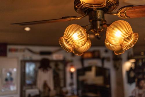 a chandelier with lights hanging from a ceiling at Hotel Hanaya in Tanabe