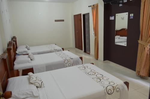 Katil atau katil-katil dalam bilik di Hotel Plaza Cúcuta Center