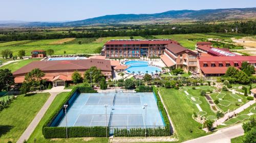an aerial view of a resort with a tennis court at Ambassadori Kachreti Golf Resort in Kachretʼi