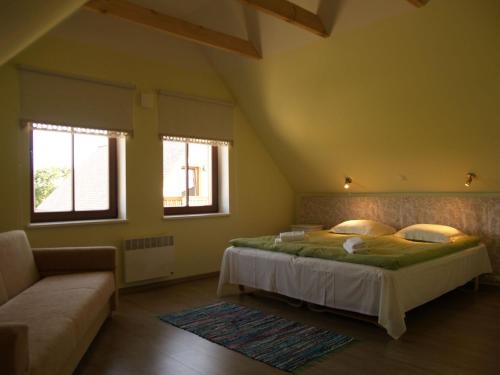 Maria Talu Guesthouse tesisinde bir odada yatak veya yataklar
