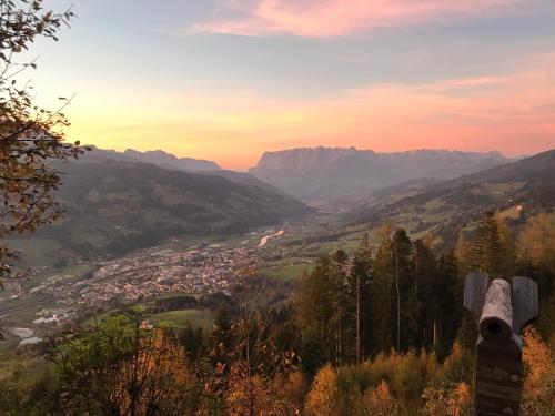 a view of a valley from a mountain at sunset at Apartment Sonnblick in Sankt Johann im Pongau