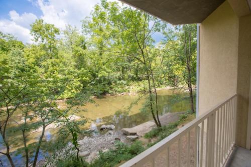 a balcony with a view of a river at Twin Mountain Inn & Suites in Pigeon Forge