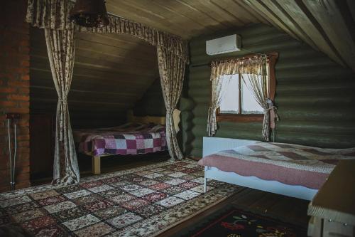 Postel nebo postele na pokoji v ubytování Sadyba Dacha