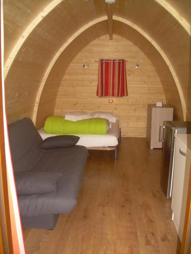 a small room with two beds and a couch at Camping Torraccia in Cargèse