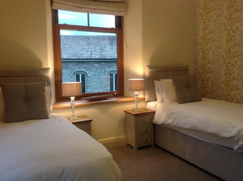 A bed or beds in a room at Grizedale View