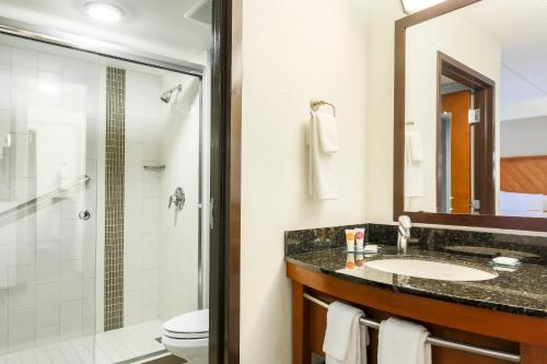 a bathroom with a sink and a shower at Hyatt Place Fort Worth/Hurst in Hurst