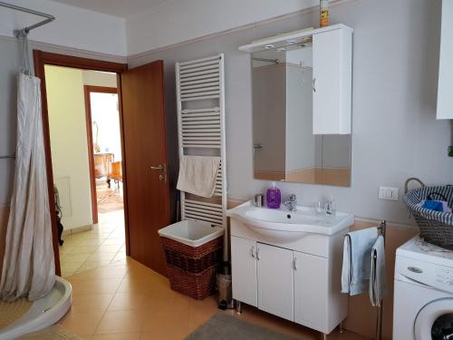 a bathroom with a sink and a mirror at B&B Il Glicine in Badia Polesine