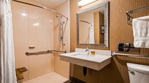 a bathroom with a sink and a shower and a toilet at Best Western Plus Portland Airport Hotel & Suites in Parkrose