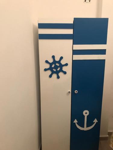 a locker with an anchor painted on it at Douja Apartment in Nabeul