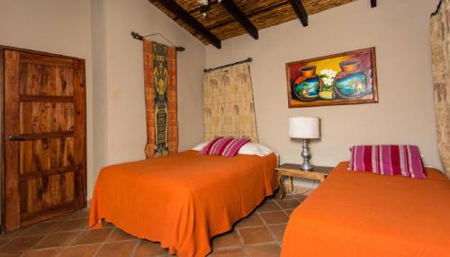En eller flere senge i et værelse på Casa Cantamar
