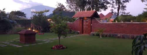 a small tree in the yard of a house at Fun Retreat Resort, Hotel and Ayurveda Spa in Arusha