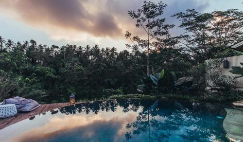 
a view of a lake from a balcony overlooking a city at Cloud Nine Estate in Ubud
