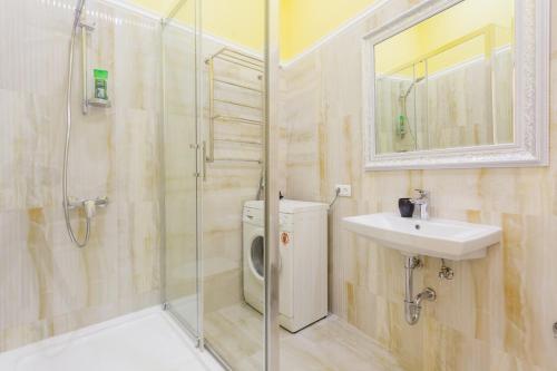 a bathroom with a shower and a sink and a toilet at Kiev Centre Apartments in Kyiv